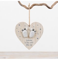 Charming wooden heart adorned with delicate scripting and pebble footprints for a newborn's room