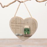 Add a charming coastal touch to your home with this heart-shaped wooden decoration