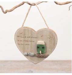 Add a charming coastal touch to your home with this heart-shaped wooden decoration