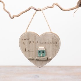 Bring coastal charm to your space with this heart-shaped hanging ornament.