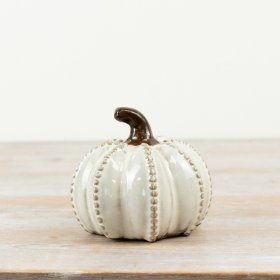 Elevate your interiors with this richly glazed and tonal pumpkin with raised details. 