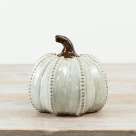 Bring cozy fall vibes to your Halloween with this delightful porcelain pumpkin ornament.
