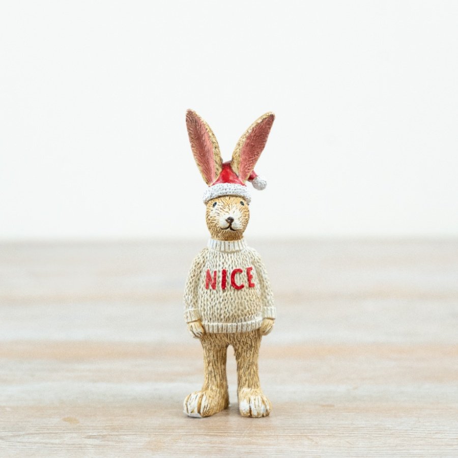 Crafted from resin with detailed texturing, this standing rabbit features a knitted-style jumper with bold 