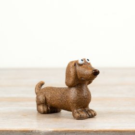 Delightful polyresin Dachshund collectible figurine.
