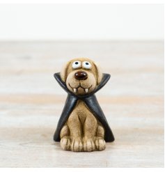 Bring fun to your seasonal decor with this adorable Halloween dog ornament.