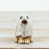 Add a touch of playful character to seasonal displays with this charming ceramic ghost ornament.