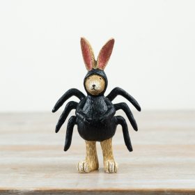 Charming polyresin figurine combining rabbit features with unique spider-inspired details.
