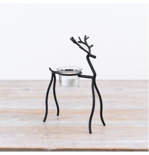 Enhance festive decor with this charming reindeer t-light holder, perfect for seasonal accents.