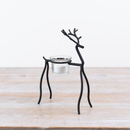 Enhance your  decor with this charming reindeer t-light holder, perfect for festive displays.