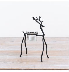 Enhance your  decor with this charming reindeer t-light holder, perfect for festive displays.