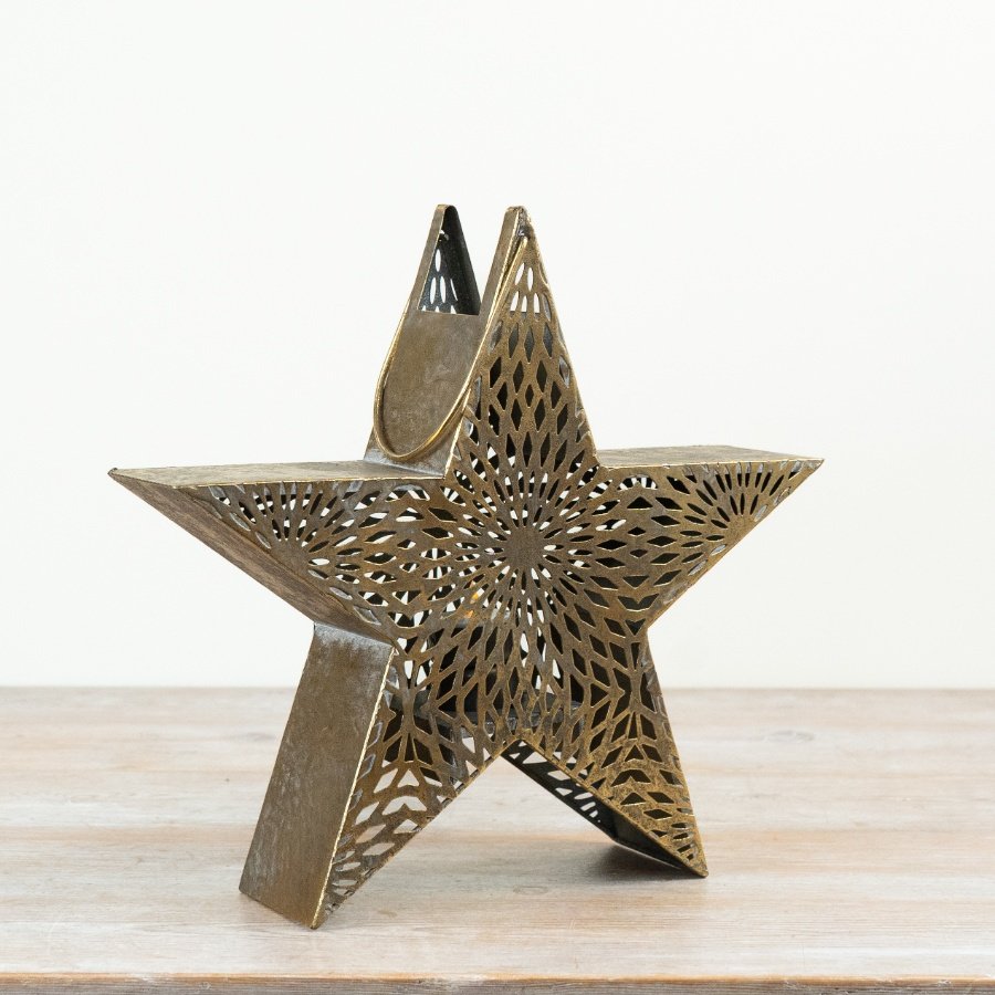 Make a statement with this striking antique gold metal star lantern.