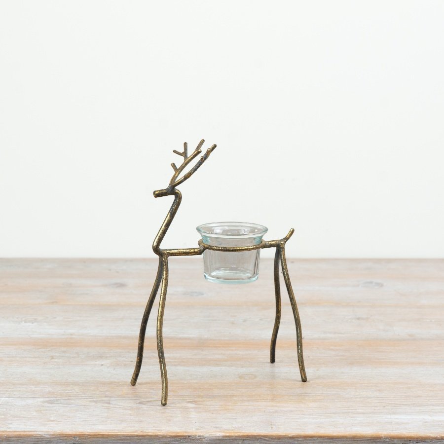 Add a refined holiday charm to your décor with this stylish reindeer t-light holder.