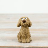 Charming Cockapoo figurine capturing the breed’s friendly and playful