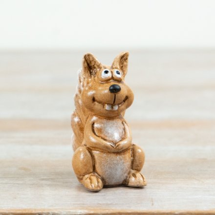 Bring warm woodland charm home with this small reactive brown squirrel ornament.