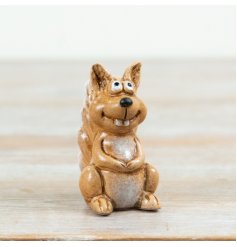 Bring warm woodland charm home with this small reactive brown squirrel ornament.