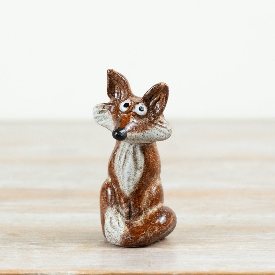 Delightful fox figurine inspired by the forest.
