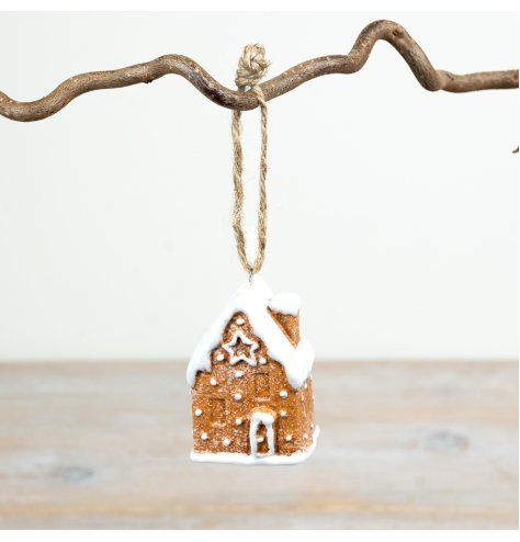 6.5cm ceramic gingerbread house hanger with classic icing details and a snowy roof design.