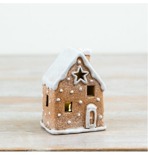Bring festive warmth with this glowing gingerbread house decoration, perfect for seasonal displays.