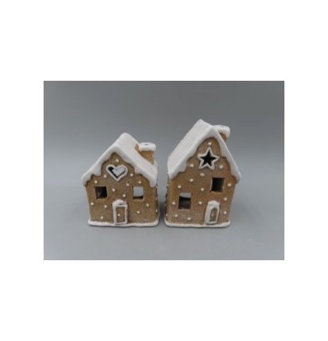 A festive gingerbread house tealight holder with icing-style detailing and cut-out windows that create a warm glow when 