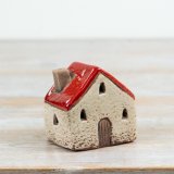 Add warmth and character to festive displays with this charming LED ceramic house.