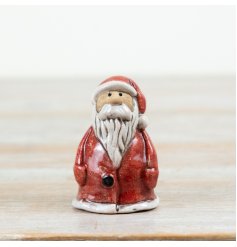 Bring timeless holiday cheer to your decor with this ceramic Santa ornament.
