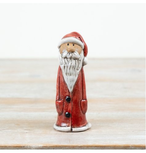 A classic ceramic Santa decoration finished in festive red with a textured white beard and traditional detailing.