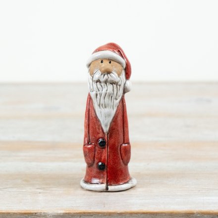 This 15cm ceramic Santa ornament features a classic red coat