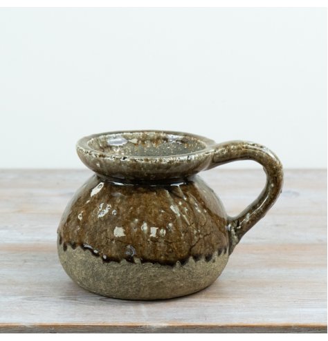 A rustic stoneware jug finished in a warm brown reactive glaze 
