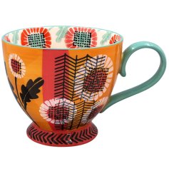a charming flower design footed mug 