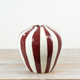 Make a bold statement in your interiors collection with this striking striped ceramic vase.