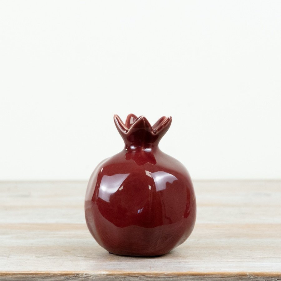 Make a bold seasonal statement with this gloss red pomegranate ornament