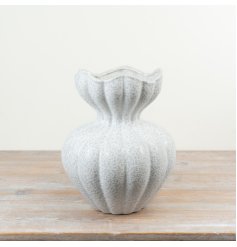 With its rounded body, vertical sculpted detailing and subtle speckled glaze