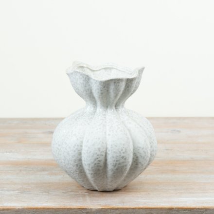 With its rounded body, vertical sculpted detailing and subtle speckled glaze