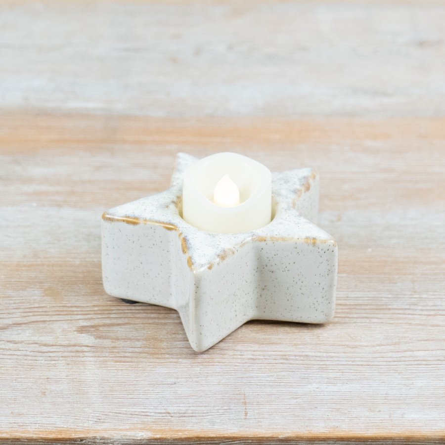 Introduce subtle texture and soft glow to seasonal displays with this ceramic star t-light holder.