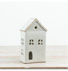 Bring a warm, homely glow to seasonal displays with this ceramic house t-light holder.