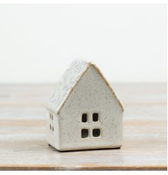 Bring soft, ambient lighting to seasonal displays with this ceramic house t-light holder.