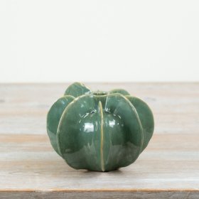 Bring depth and seasonal interest to your home décor range with this green glazed natural vase.