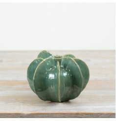 Enhance your decor with this glazed vessel vase, featuring vibrant seasonal colors.