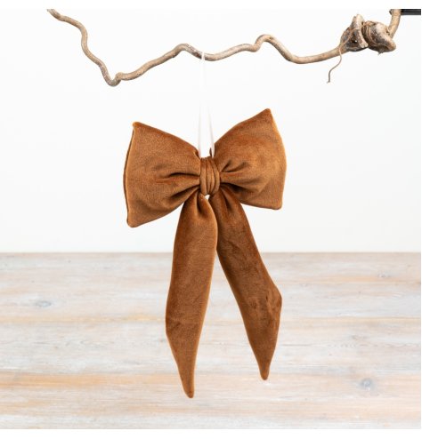 Enhance seasonal decor with this cozy, elegant velvet hanging bow.