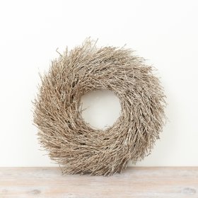 Enhance seasonal decor with this twig wreath, featuring natural texture and subtle elegance.