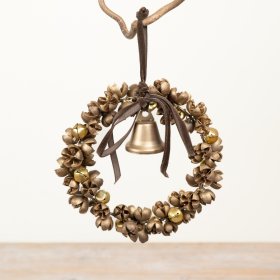 A decorative hanging wreath crafted from metallic gold-toned natural materials and finished with a coordinating ribbon