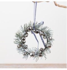 Add a delicate holiday shimmer to your decor with this charming mini wreath.