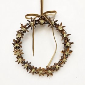 A charming wreath made from natural star anise pods, finished with delicate gold detailing and a soft gold hanging ribbo