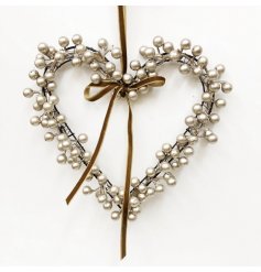 Elegant heart-shaped wreath with metallic berries on wire, adorned with a luxurious ribbon finish.