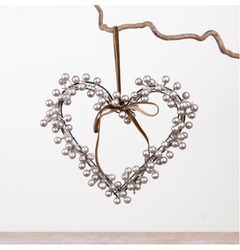 Elegant heart wreath of metallic berries on a slender wire frame, completed with a luxurious ribbon bow.