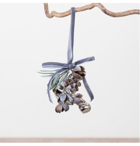 Elegant hanging decor with frosted pinecones, shiny jingle bells, and gentle winter greenery.