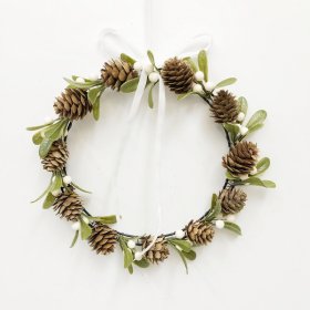 Decorative mini wreath featuring pinecones, mistletoe-style foliage and berry accents.