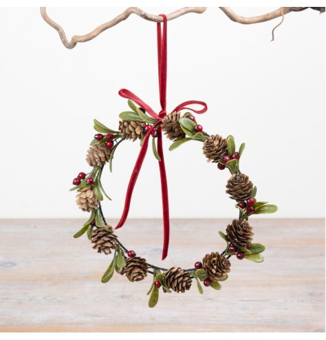 Classic Christmas wreath crafted from natural pinecones for a rustic holiday touch.