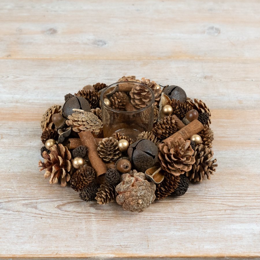 Crafted with layered pinecones, cinnamon sticks and complementary decorative elements