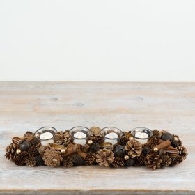 Crafted with layered pinecones, natural foliage elements and subtle decorative detailing
